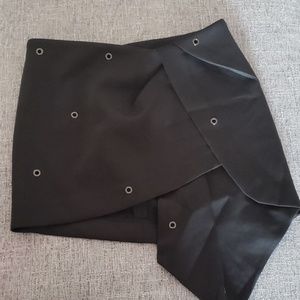 Unbalanced black mini skirt